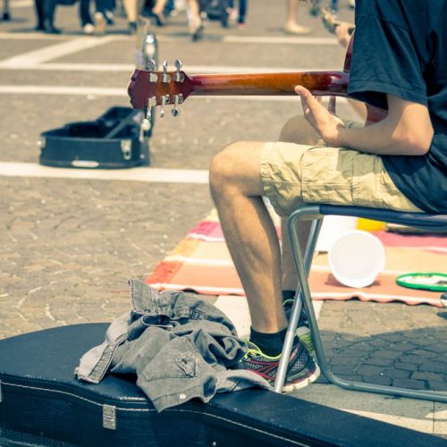 Street artist playing guitar